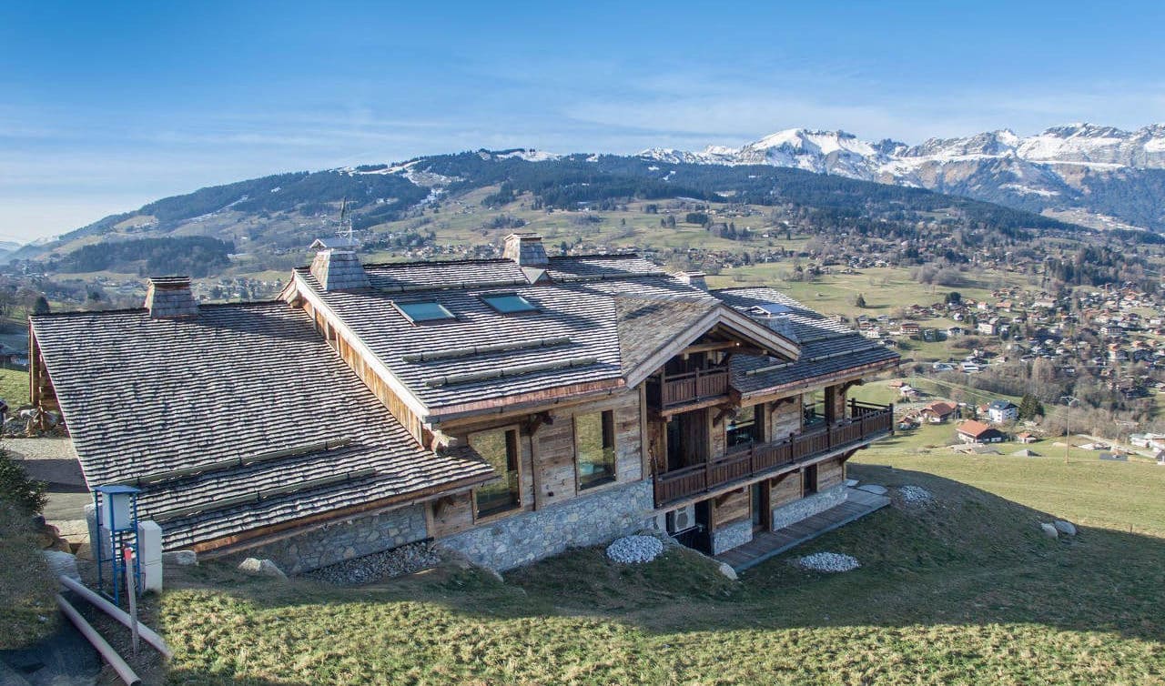 chalet-ararat-megeve-exterior-summer-with mountains in the background