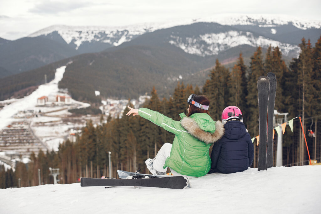 mother-with-daughter-skiing-people-snowy-mountains.jpg