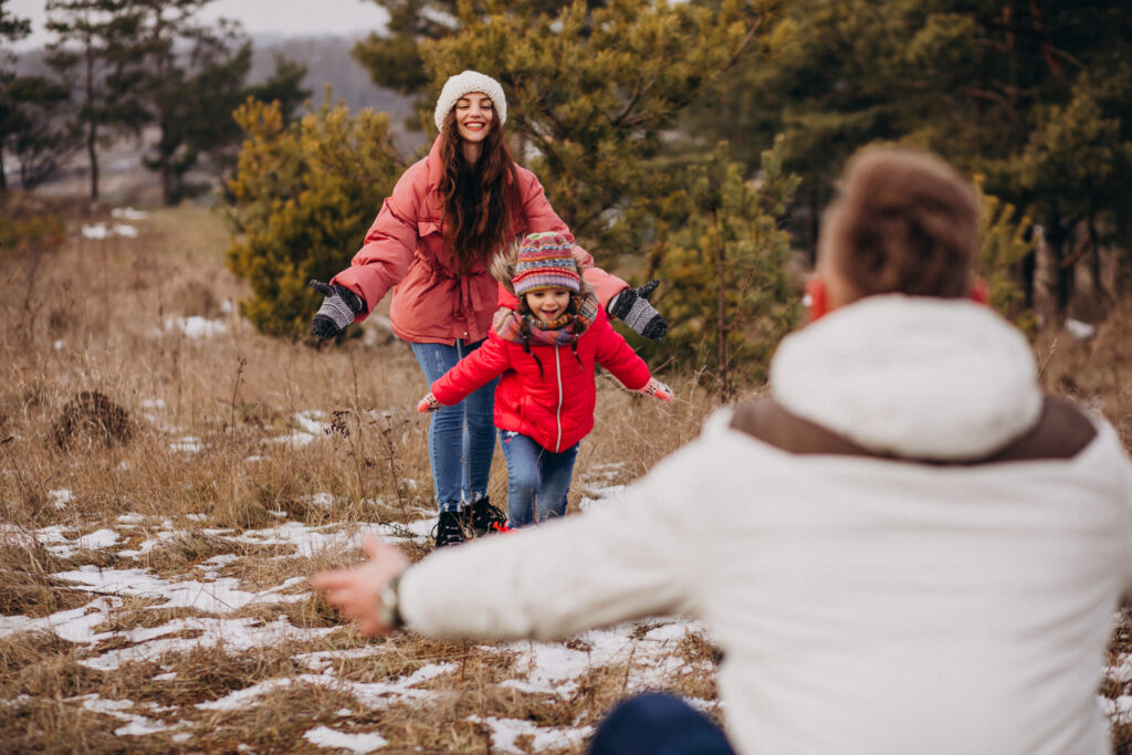 young-family-together-walking-forest-winter-time.jpg