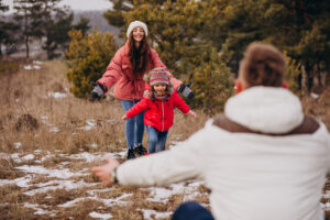 young-family-together-walking-forest-winter-time.jpg